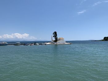 Scenic view of sea against blue sky