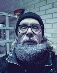 Portrait of man wearing eyeglasses