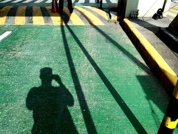 Shadow of man standing on floor