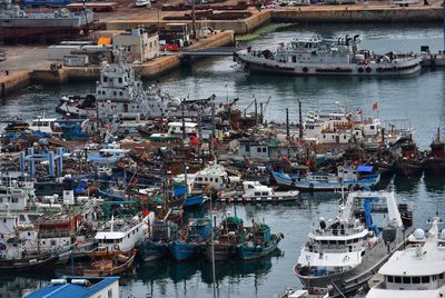 High angle view of boats moored at harbor