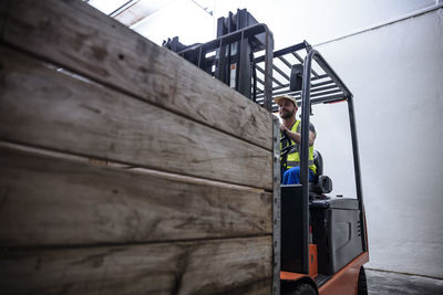 Man on forklift in warehouse