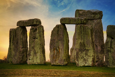 Panoramic view of rocks on field against sky