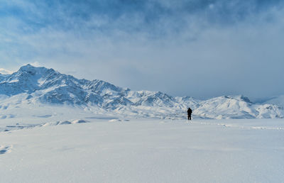 Scenic view of snow covered mountains against sky