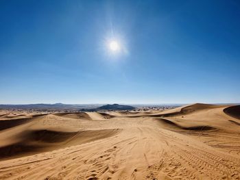 Scenic view of desert against clear sky