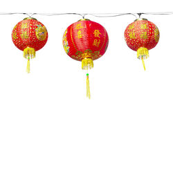 Low angle view of lanterns hanging against clear sky