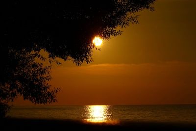 Scenic view of sea against sky at sunset