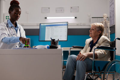 Female doctor working in office