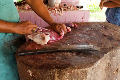 Midsection of man preparing food