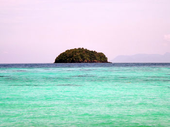 Rock formation with sea in background