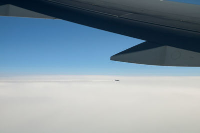 Airplane flying over clouds
