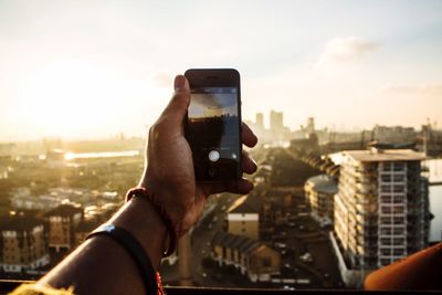 Cropped image of woman looking at cityscape