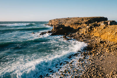 Scenic view of sea against clear sky