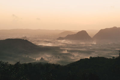 Scenic view of mountains against sky during sunset