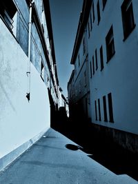 Street amidst buildings against sky