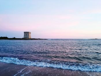 Scenic view of sea against clear sky during sunset