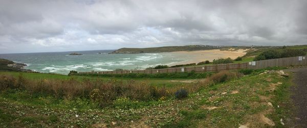 Scenic view of sea against cloudy sky