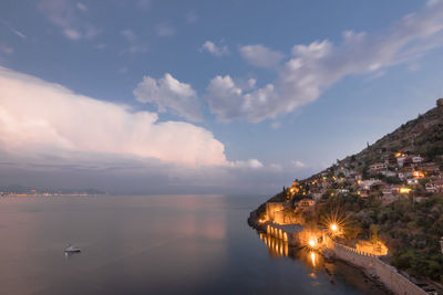 Shipyard, tersane, and the ruins of a medieval fortress, alanya castle, on the mountainside.