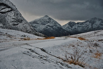 Beautiful view from the side of the road surrounded by icy mountains in brosmetinden, norway