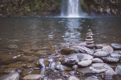 Close-up of pebbles in water