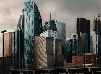 Panoramic view of buildings in city against sky