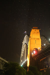 Low angle view of illuminated building at night