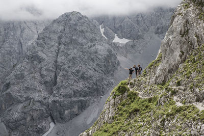 Hikers standing at the edge of ehrwalder sonnenspitze