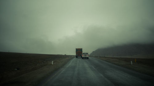 Car on highway against sky