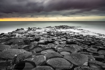 Scenic view of sea against sky at sunset