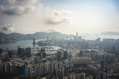 High angle view of city and buildings against sky