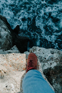 Low section of person on rock