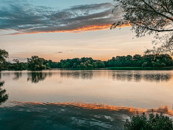 Scenic view of lake against sky during sunset