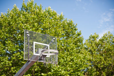 Low angle view of basketball hoop against sky