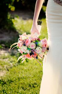 Close-up of woman holding flower