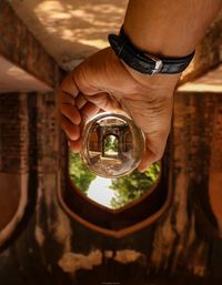 Close-up of man holding cigarette