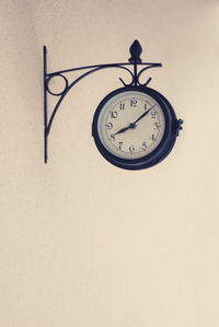 Close-up of clock on wall