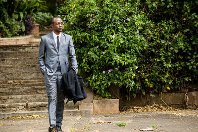 Business man in suit walking alone