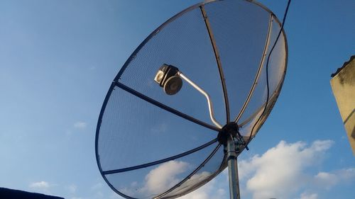 Low angle view of satellite dish against blue sky