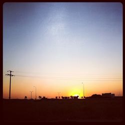 View of power lines against clear sky