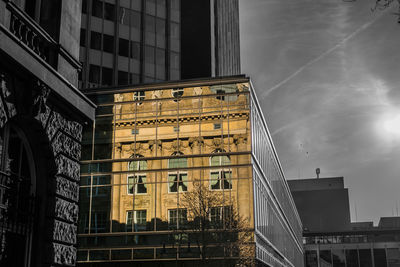 Low angle view of buildings in city against sky