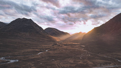 Scenic view of mountains against sky during sunset