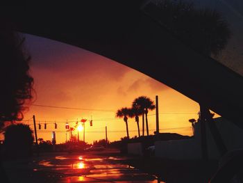 Cars on road at sunset