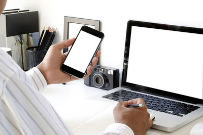 Low angle view of person using mobile phone