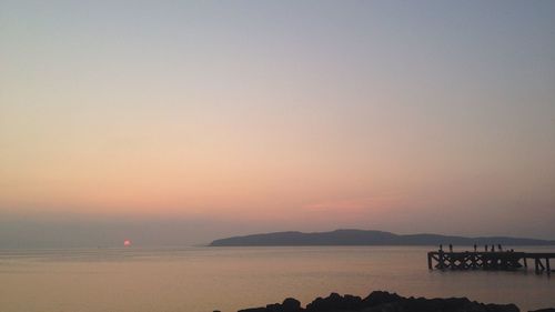 Scenic view of sea at sunset
