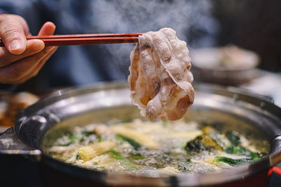 Close-up of person preparing food