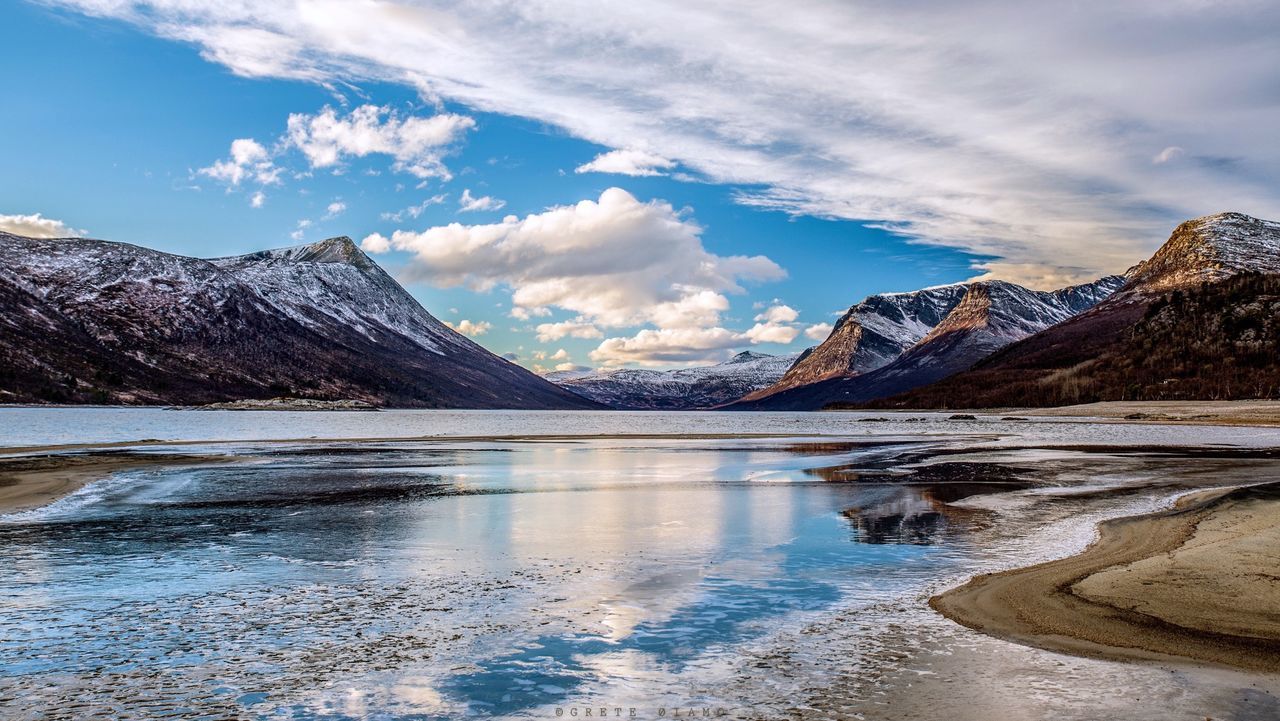 SCENIC VIEW OF LAKE AND MOUNTAINS