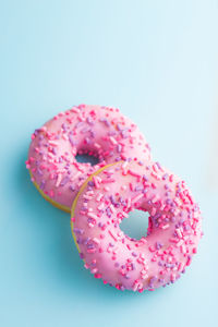 Close-up of pink cake against white background