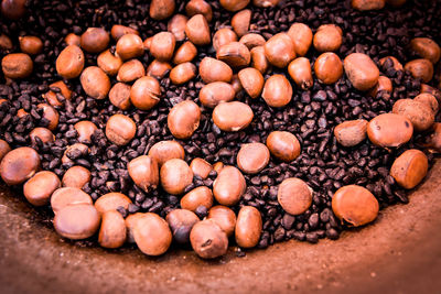 Close-up of roasted coffee beans with chestnuts