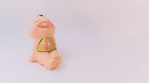 Close-up of stuffed toy over white background