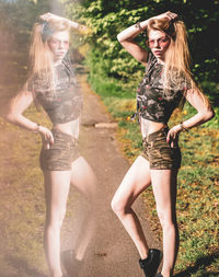 Digital composite image of young woman reflecting in glass while posing on footpath