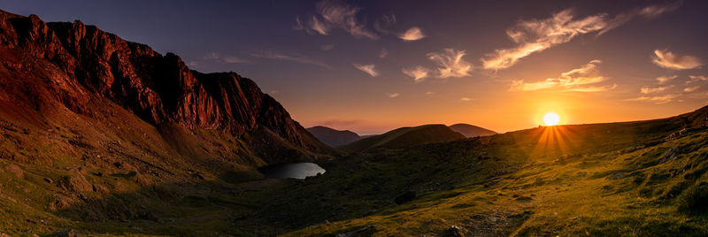 Scenic view of mountains against sky during sunset